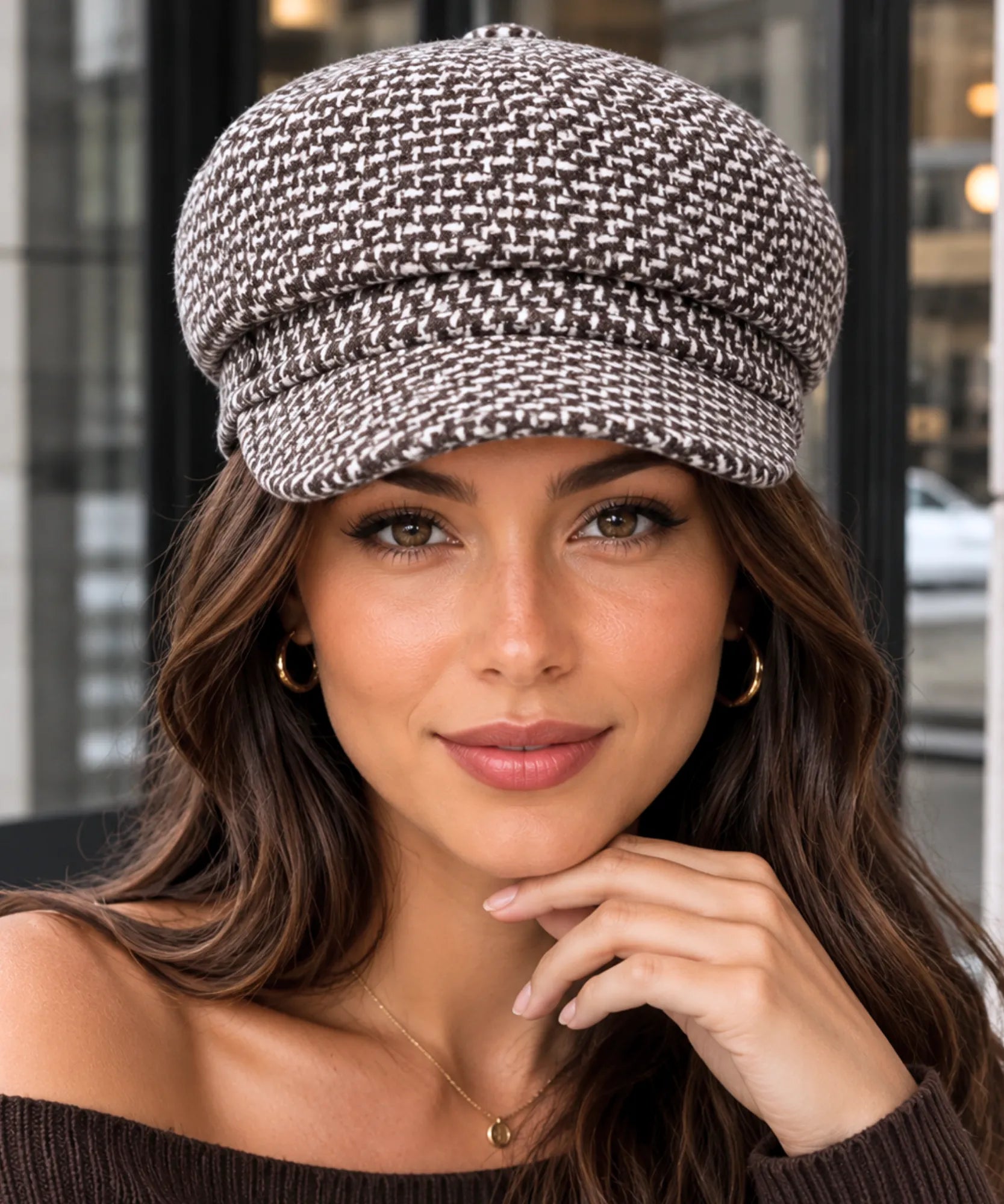 Side profile view of the brown houndstooth tweed newsboy cap