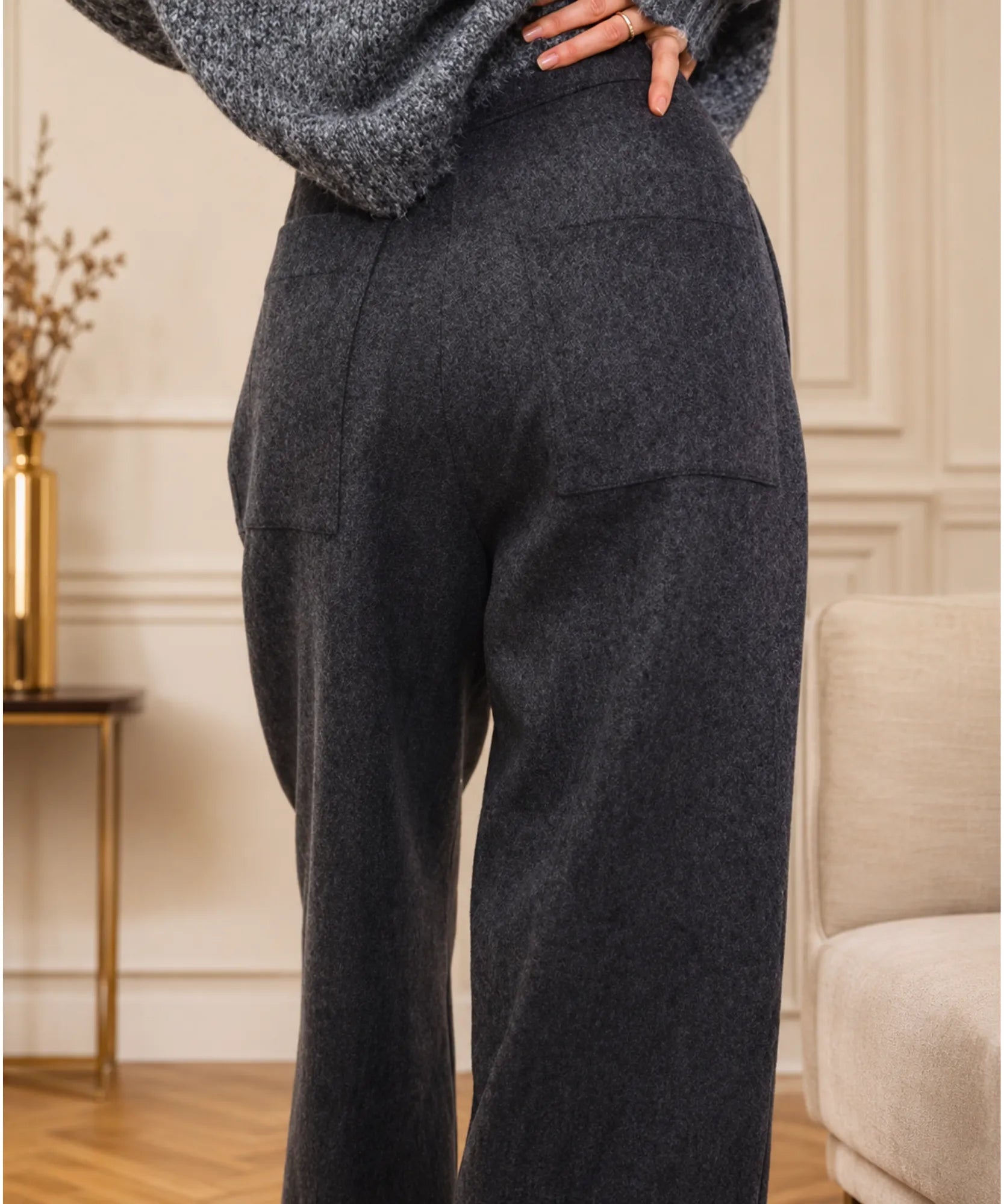Close up of the patch back pocket and wool blend texture on charcoal trousers