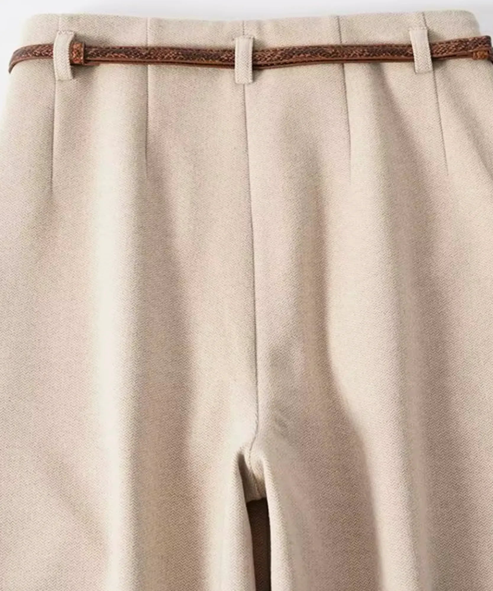 Beige wide leg trousers waistband with front pleats and belt loops flat lay