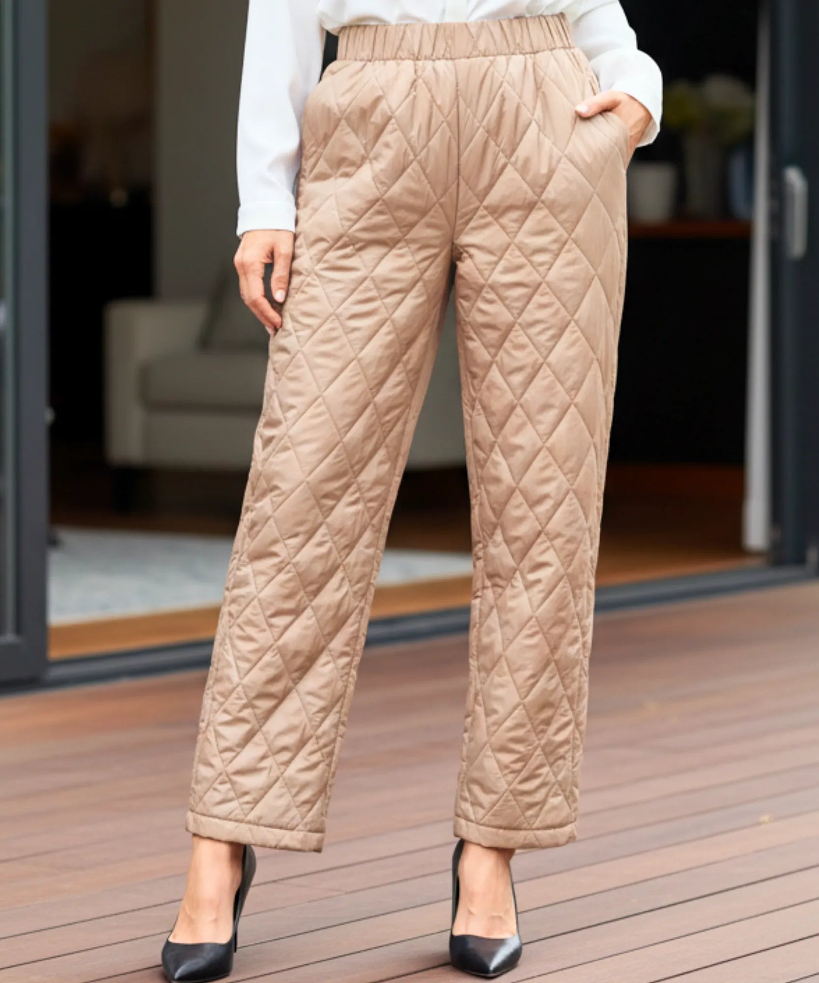 Women's quilted thermal pants in camel, close-up
