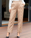 Women's quilted thermal pants in camel, close-up