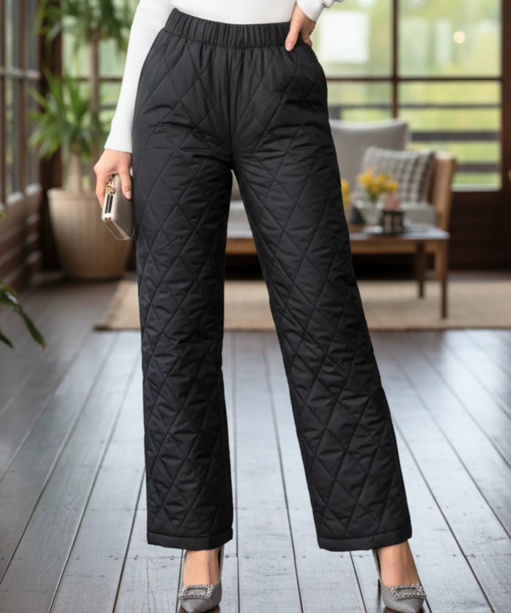 Women's quilted thermal pants in black, front view