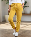 Close-up of yellow sherpa-lined joggers showing the drawstring waist