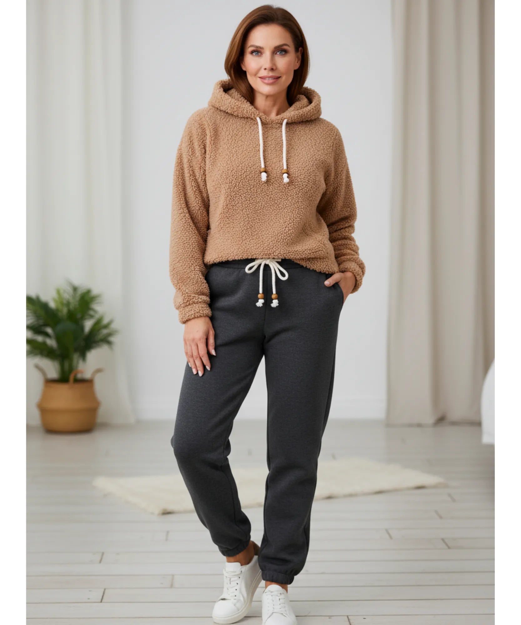 Woman wearing charcoal grey sherpa-lined joggers