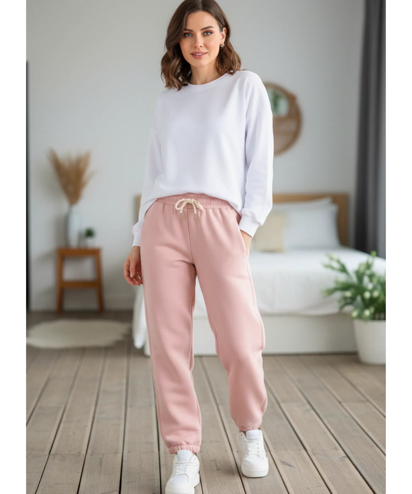 Close-up of hot pink sherpa-lined joggers showing the drawstring waist