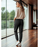 Women's fleece-lined sweatpants in black, side view