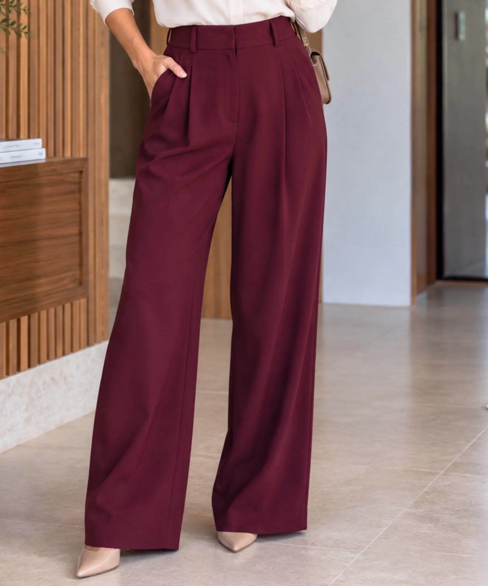 Burgundy pleated wide-leg trousers, high-waisted detail