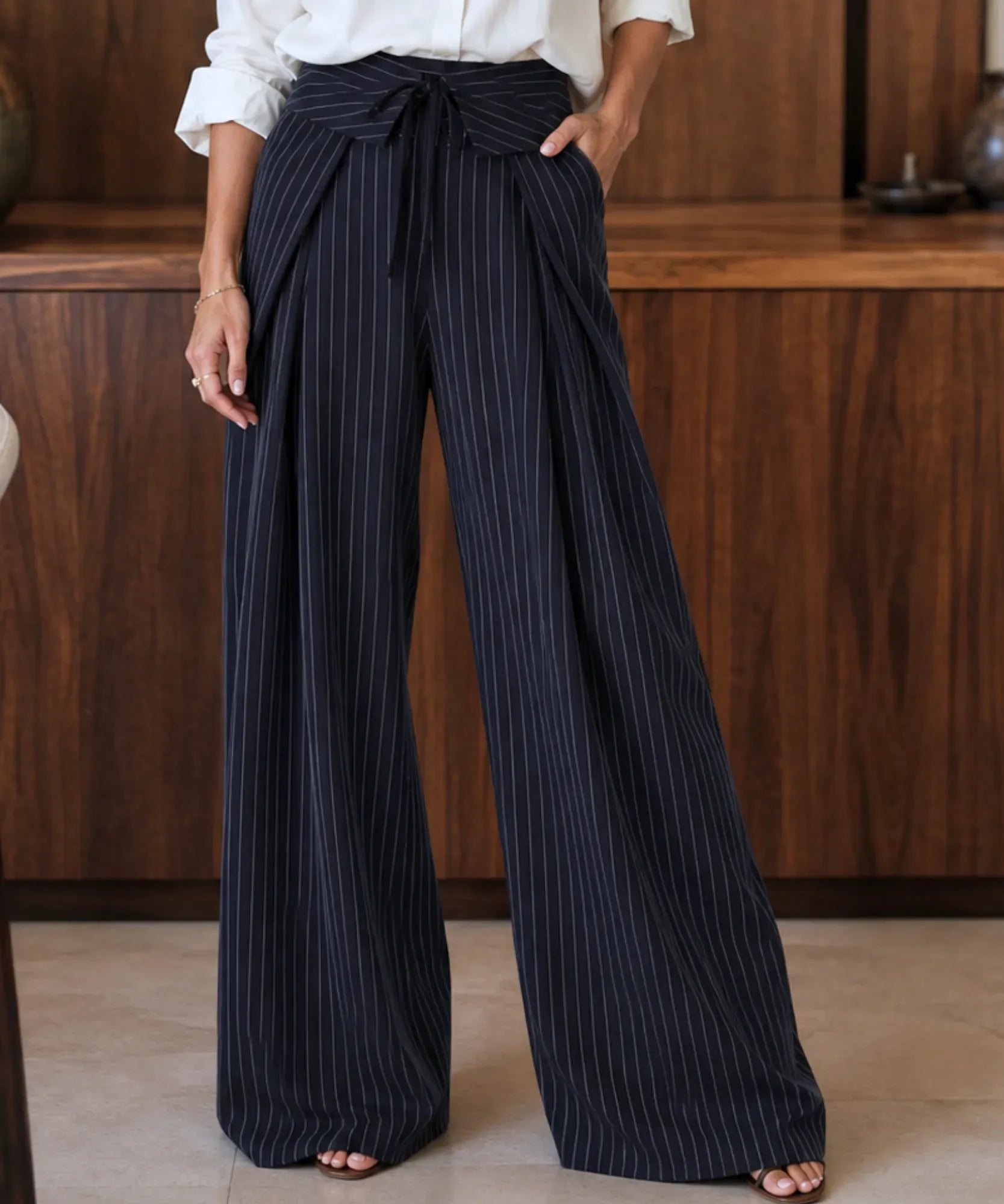 Women's navy pinstripe wide leg pants with a tie waist