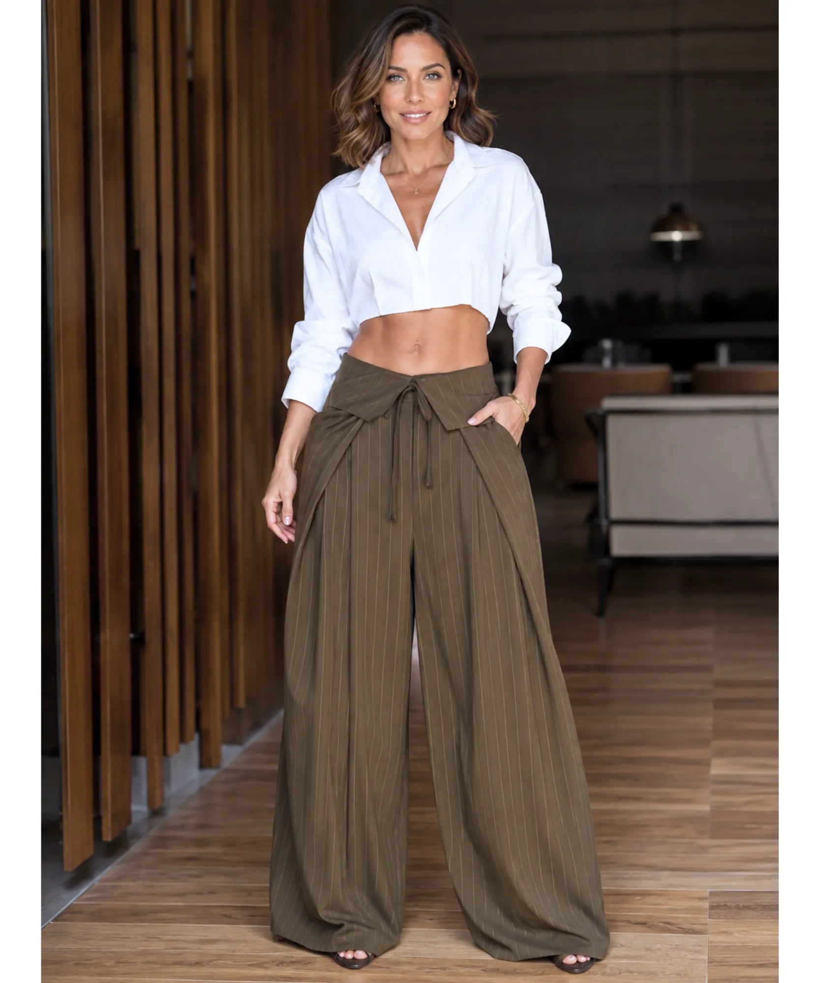 Women's olive green pinstripe wide leg pants with a tie waist styled with a white shirt
