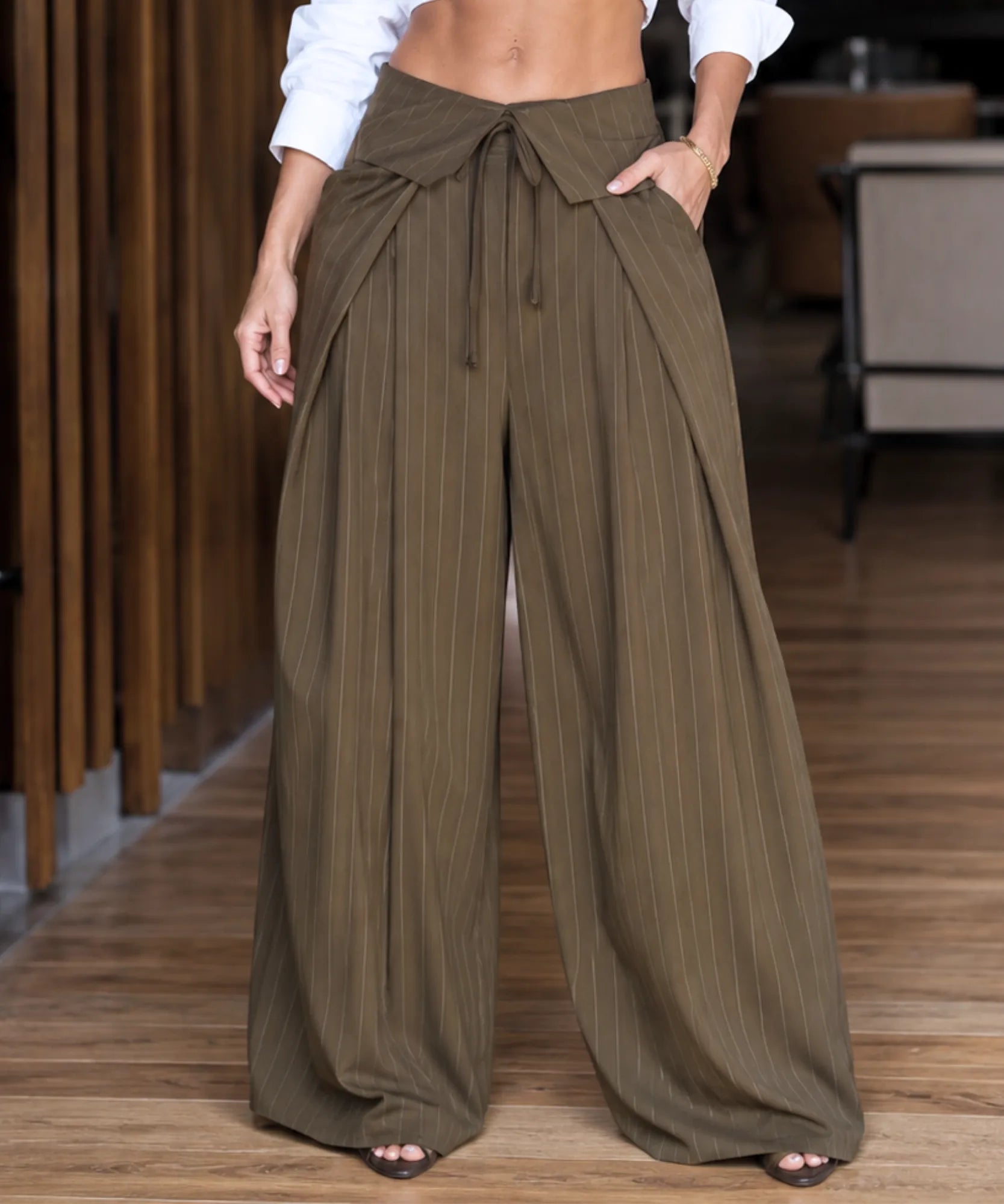 Women's olive green pinstripe wide leg pants with a tie waist front view