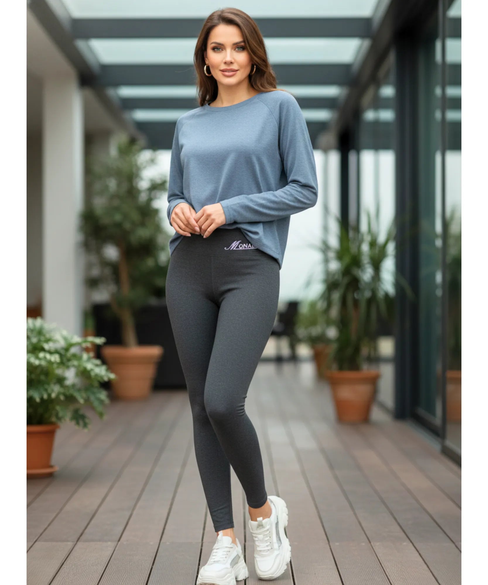 Close-up of grey fleece-lined leggings showing the brushed flannel exterior