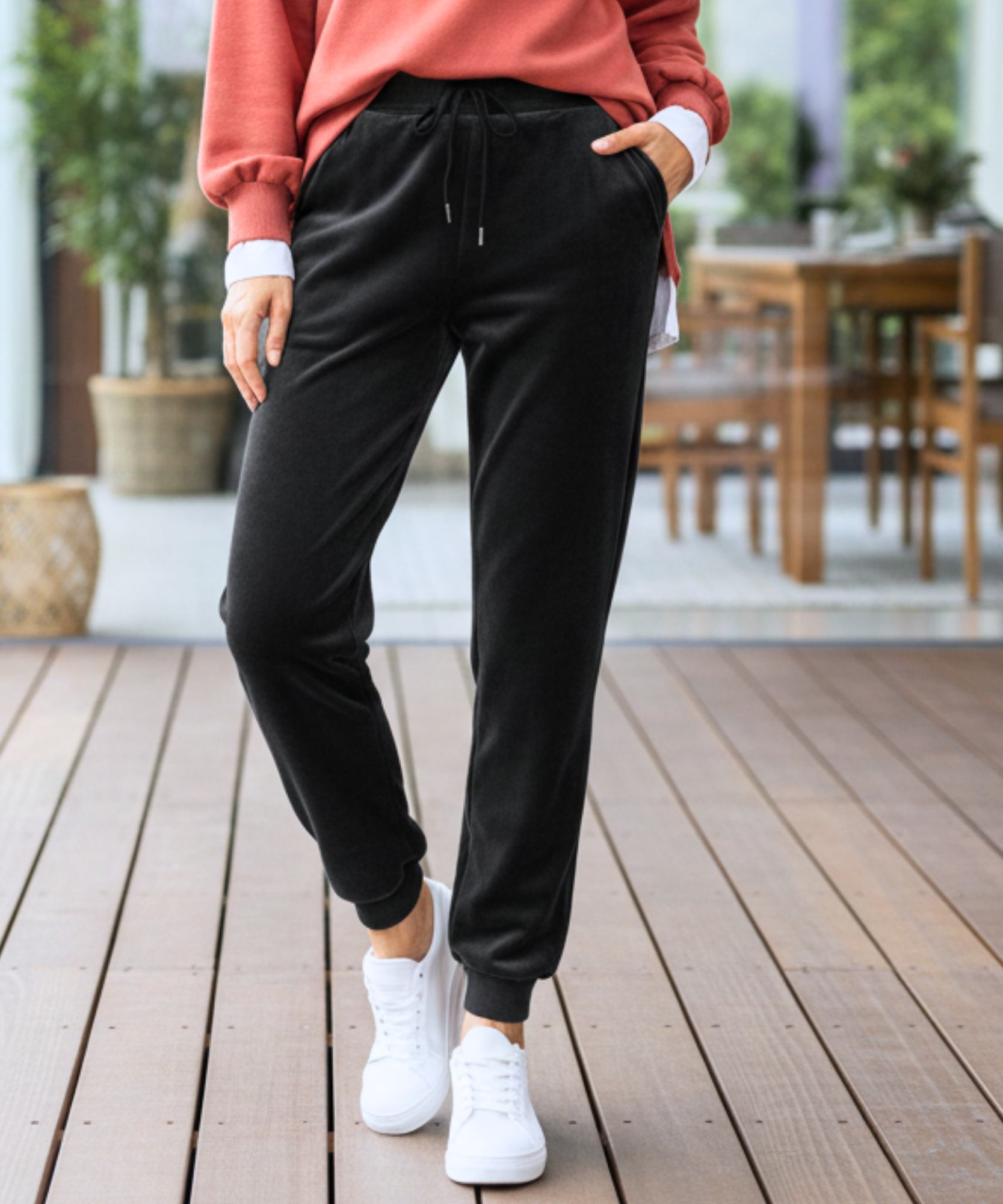 Woman wearing black velvet joggers with a sherpa lining