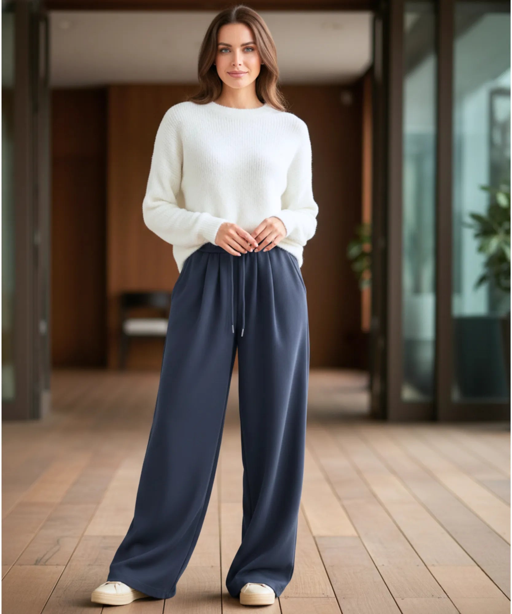 Close-up of navy fleece-lined wide-leg sweatpants showing the fabric texture