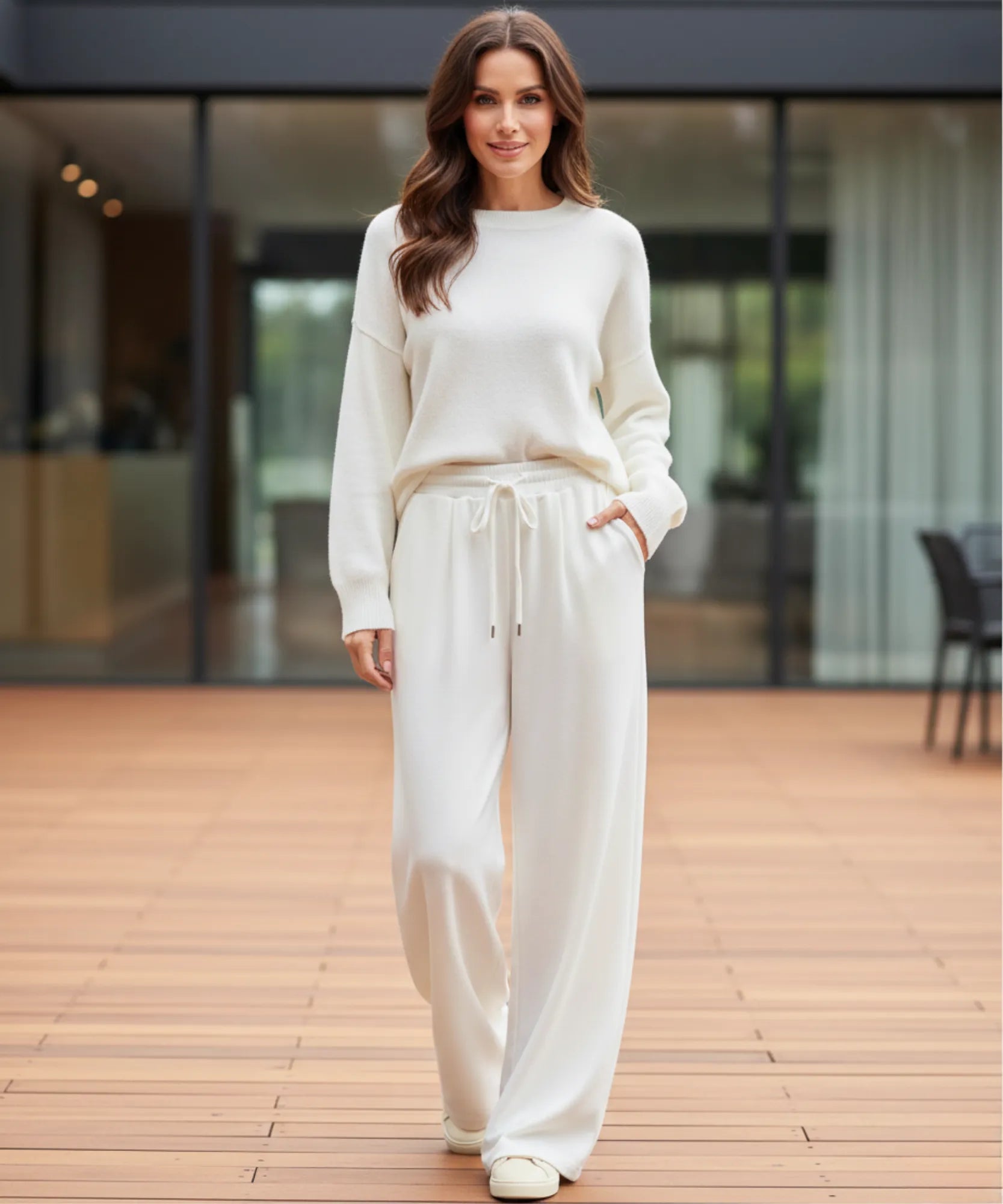 Close-up of white fleece-lined wide-leg sweatpants showing the drawstring waist