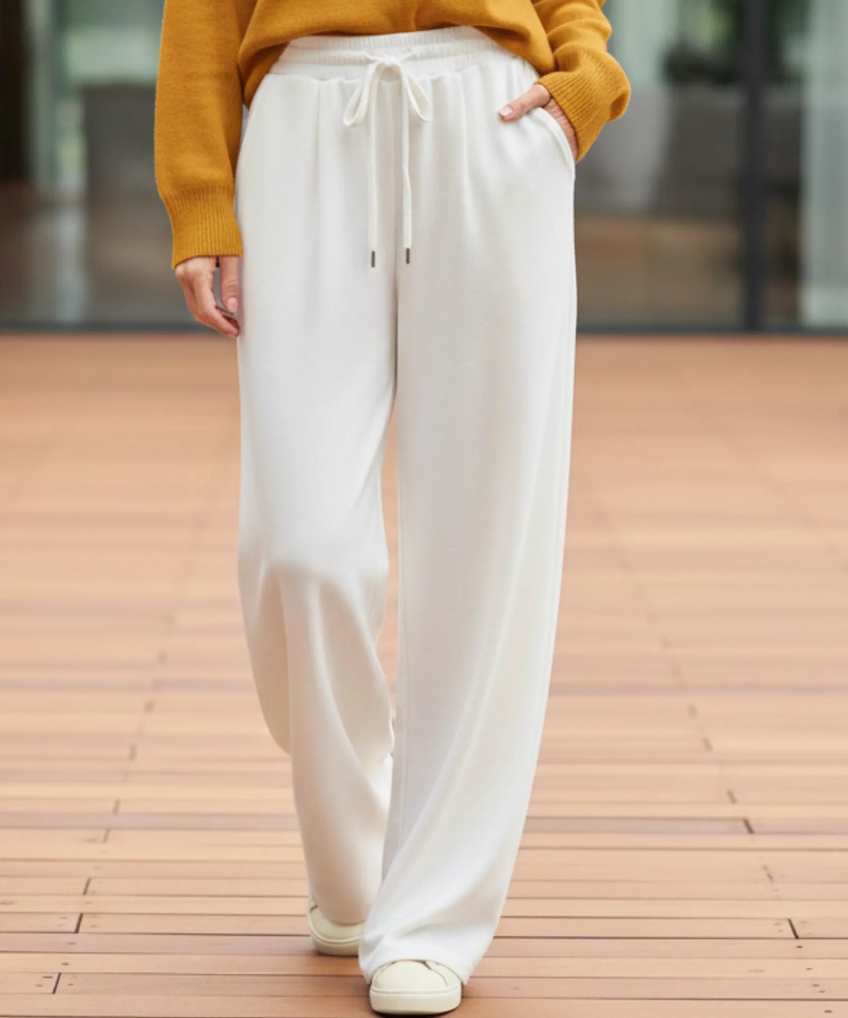 Woman wearing white fleece-lined wide-leg sweatpants