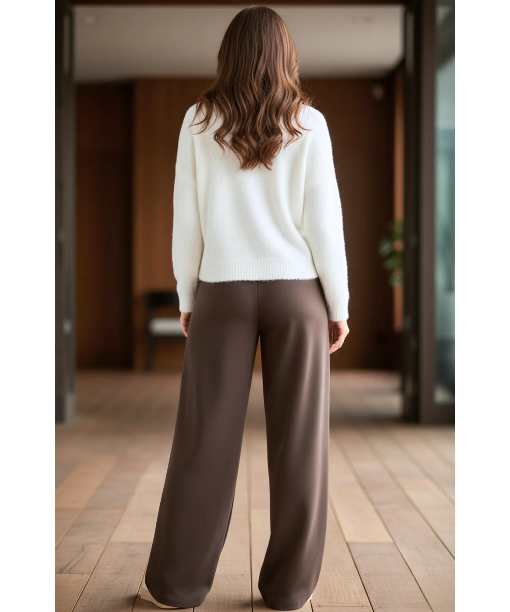 Woman wearing dark brown fleece-lined wide-leg sweatpants