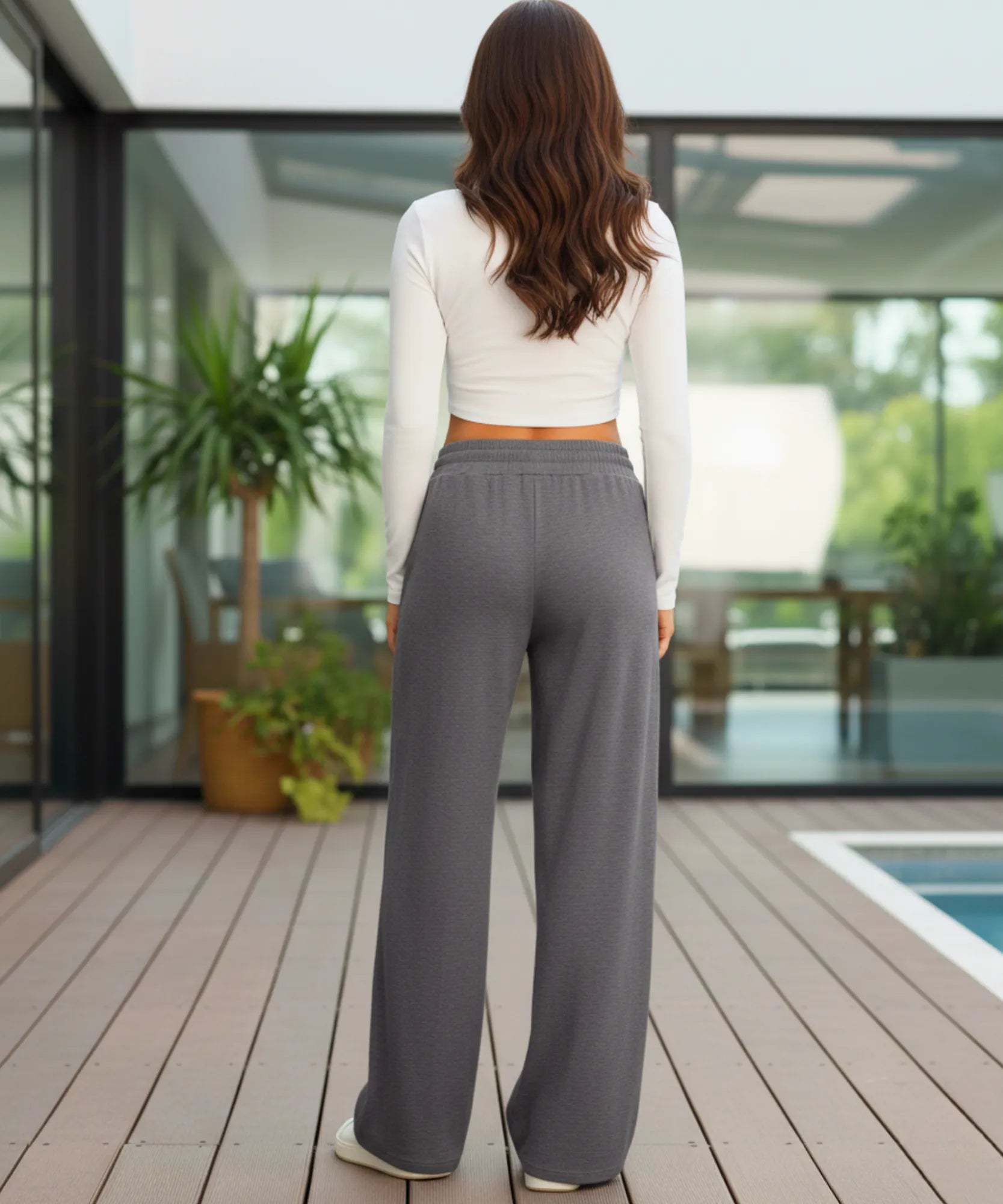 Women's wide leg sweatpants, a grey tone, styled look