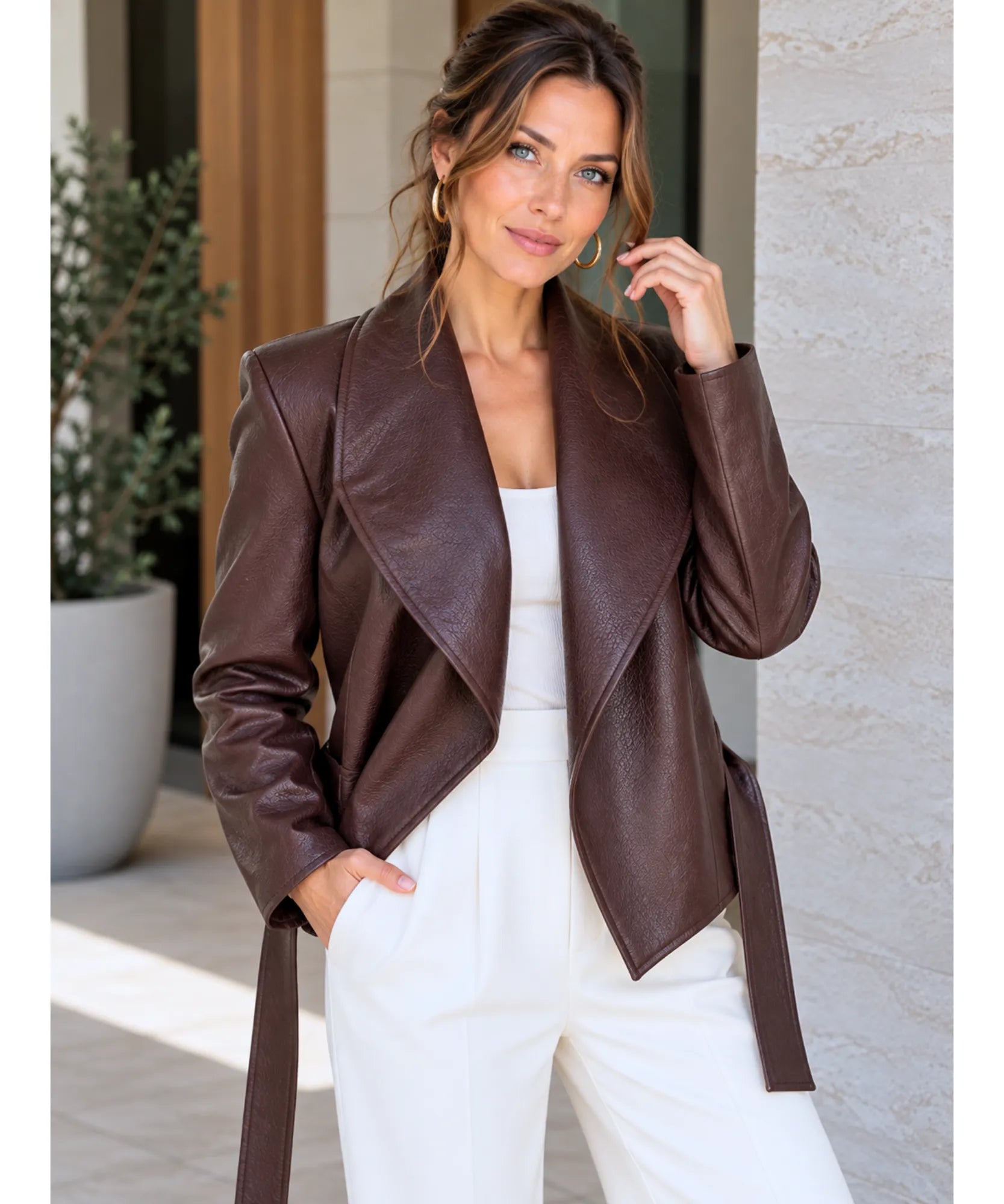 Women's cropped belted vegan leather blazer in chocolate brown with wide lapels