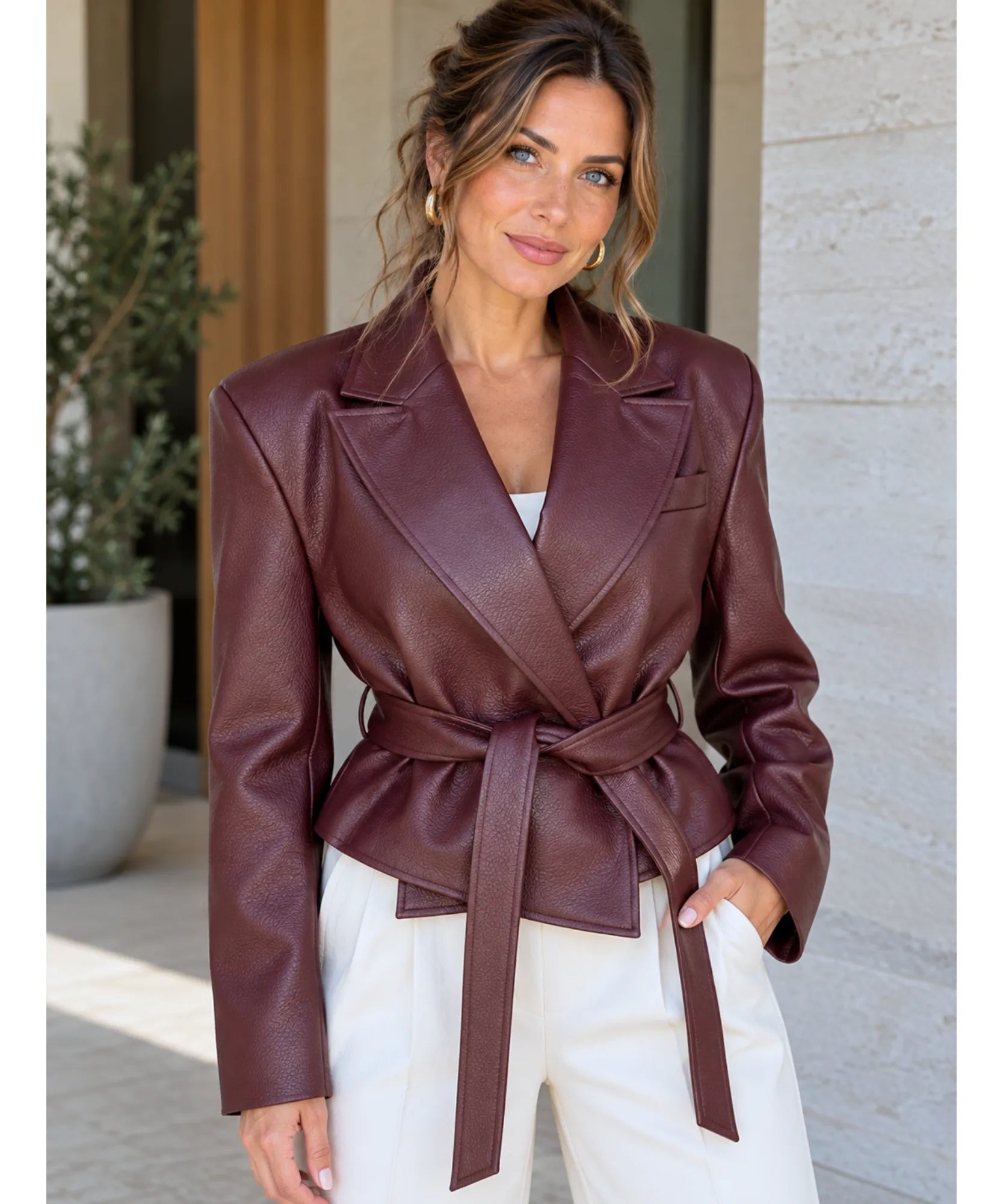 Women's belted vegan leather blazer in burgundy with wide notch lapels