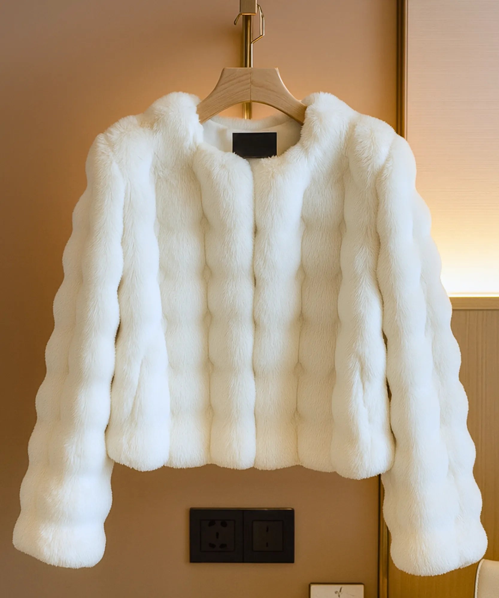 Women's cropped vegan fur jacket in ivory, close-up texture