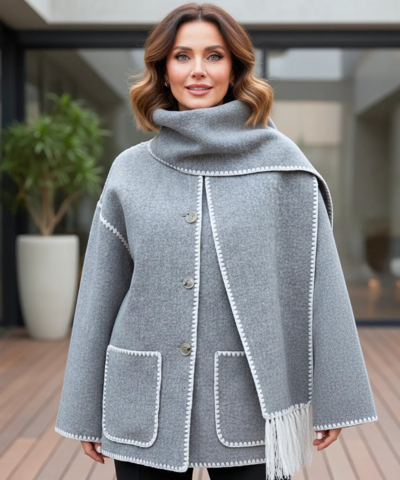 Close-up of the grey wool coat's draped collar