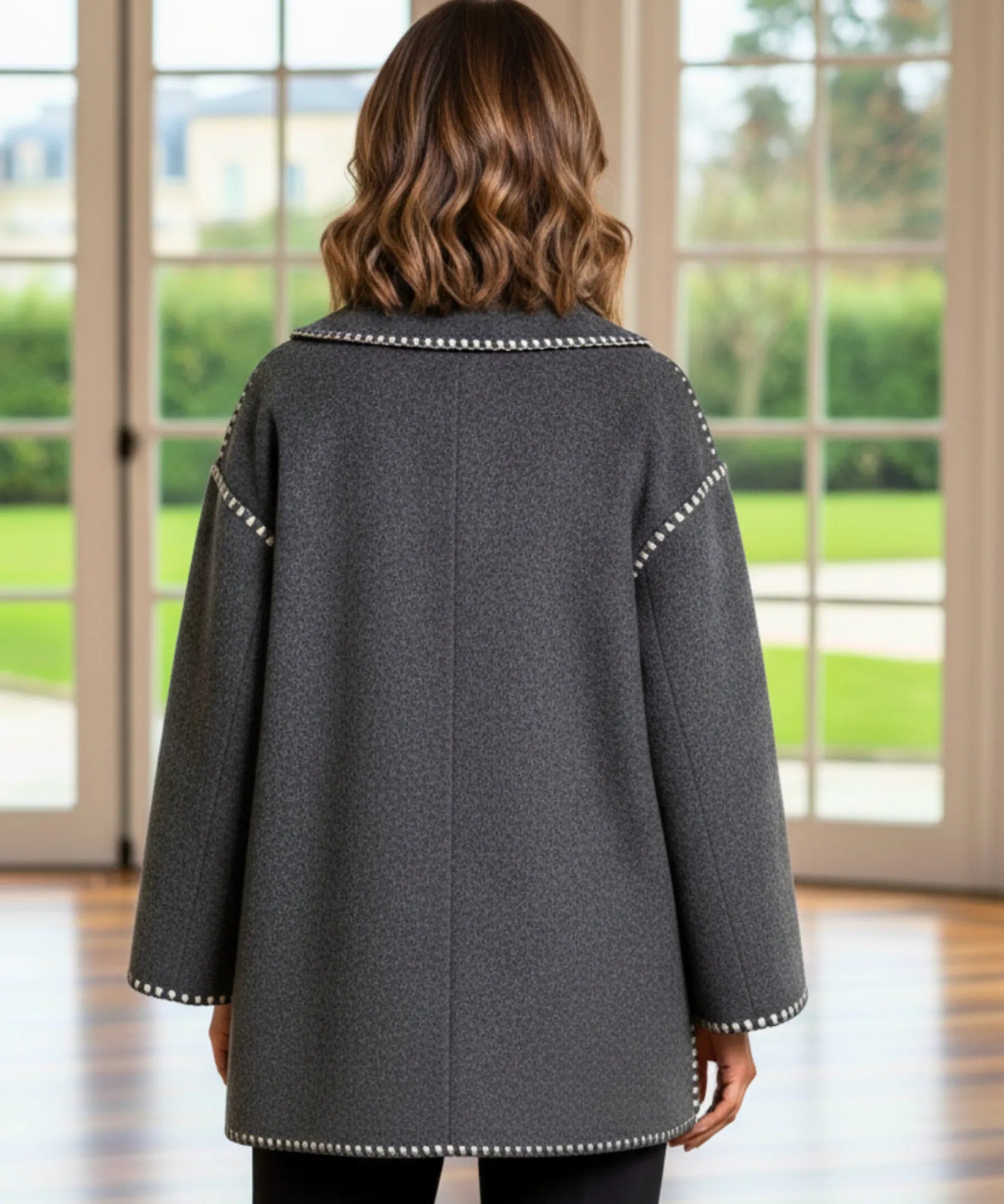Woman wearing a wool cape coat in grey