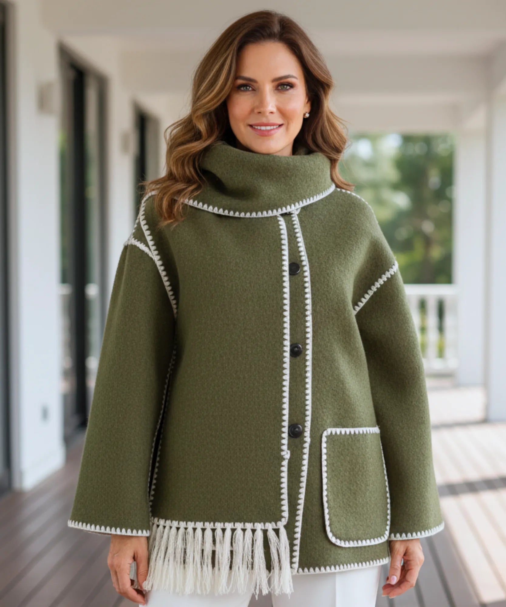 Woman styling the charcoal wool cape coat outdoors