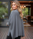 Woman wearing an oversized wool wrap coat in charcoal