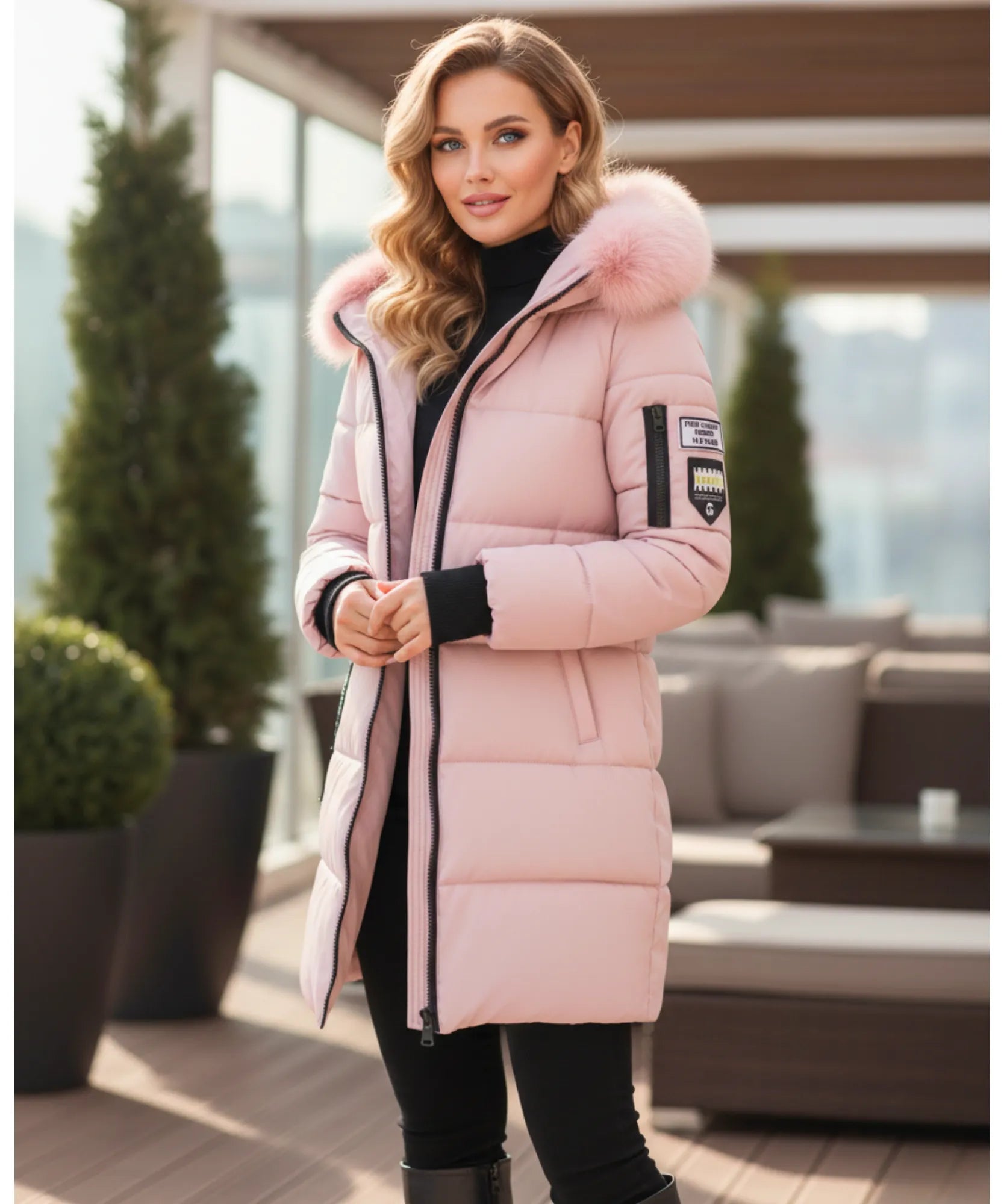 Detail of the blush pink parka coat hood and fur trim