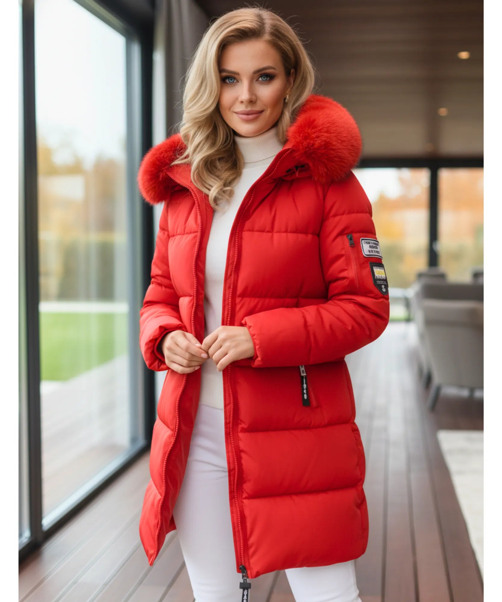 Woman wearing a long hooded parka coat in red