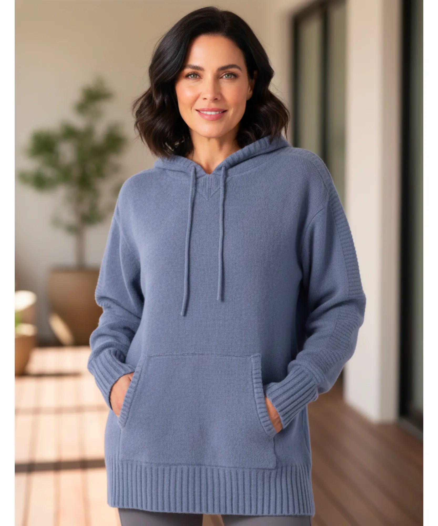Women's knit hooded sweater with drawstring and ribbed cuffs