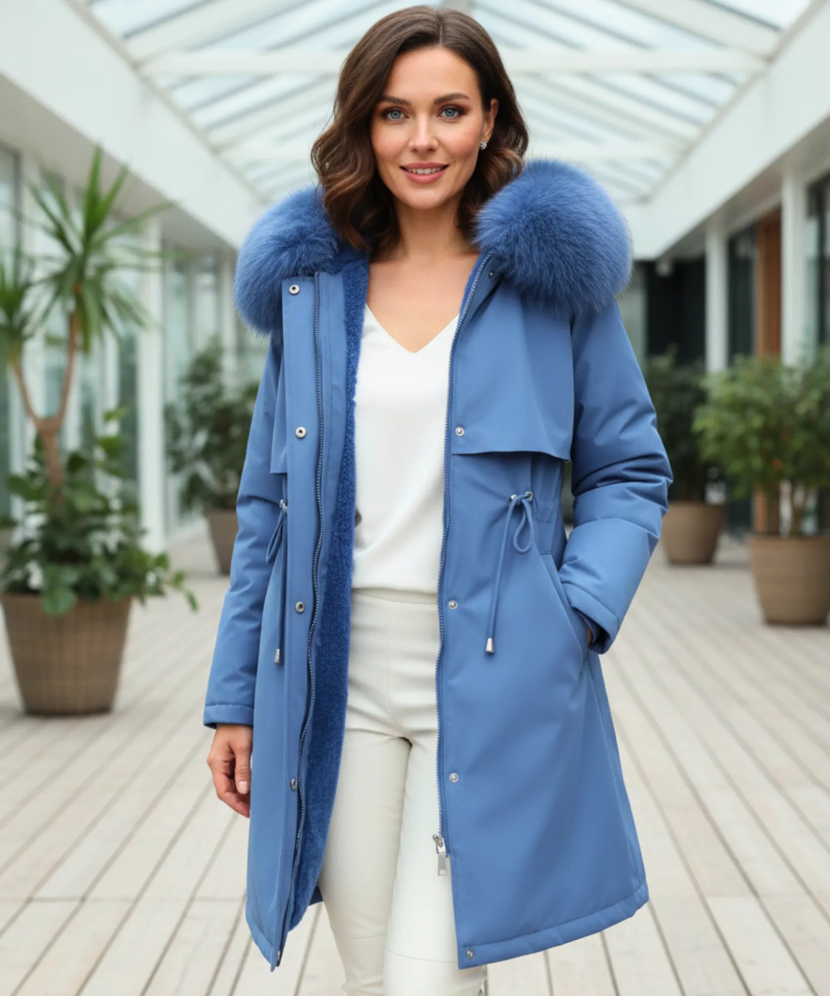 Woman styling the slate blue parka coat outdoors