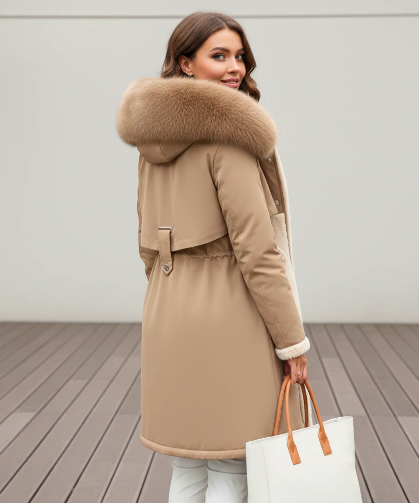 Detail of the removable fur trim on the camel parka coat