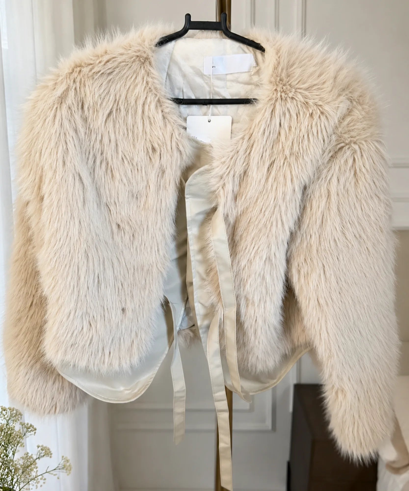 Women's short fur jacket in nude, front view
