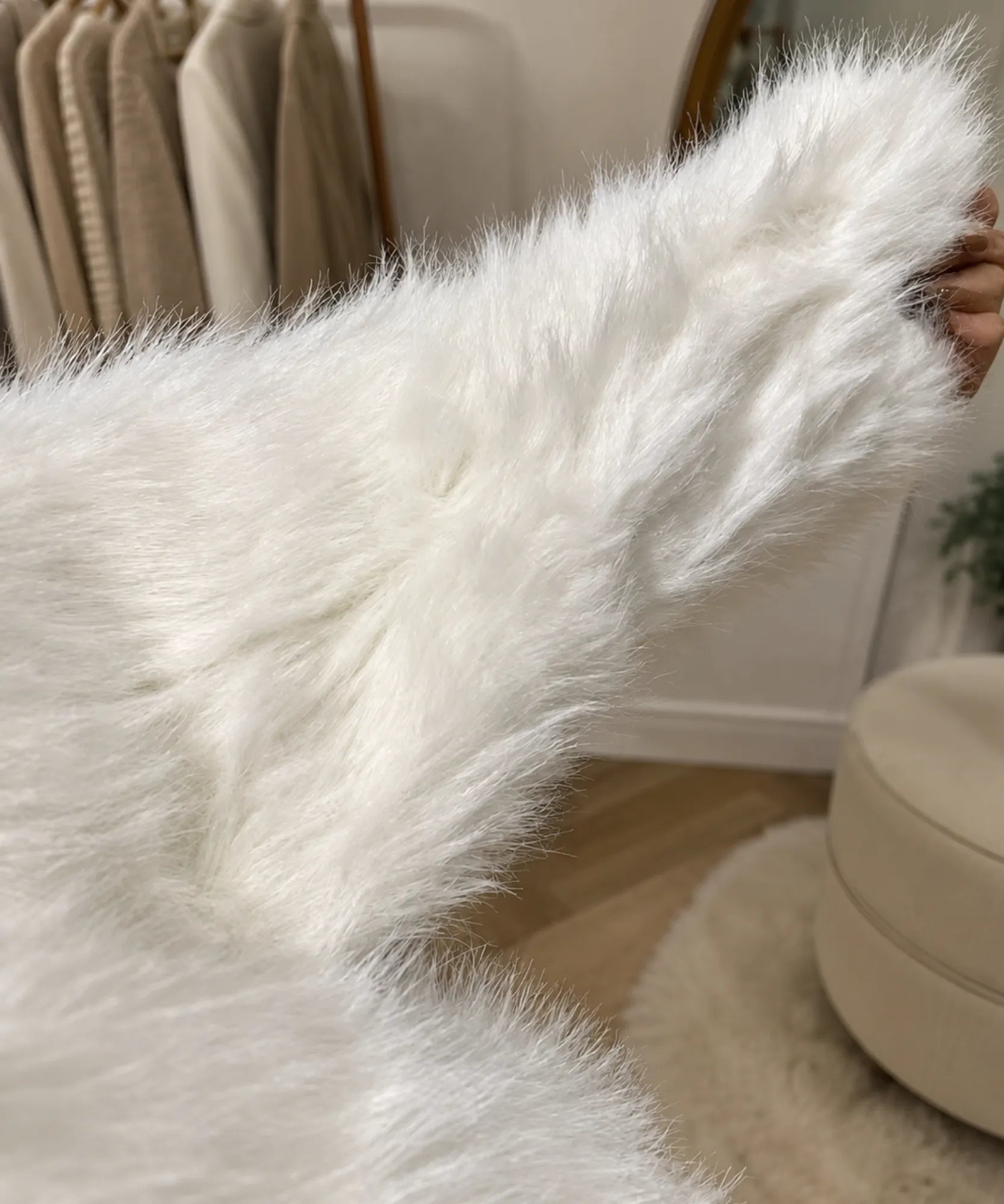 Women's short fur jacket in nude, close-up detail