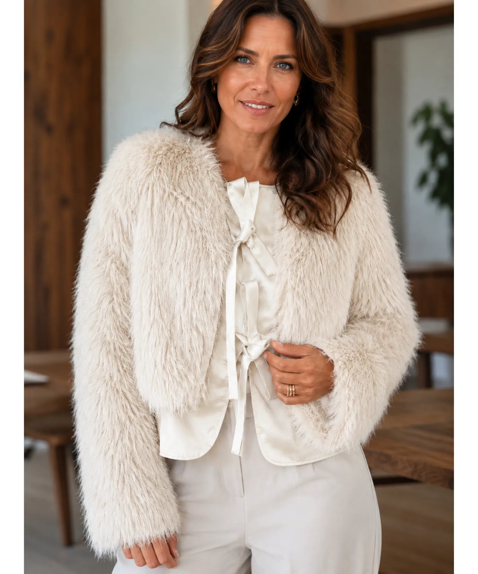 Women's short fur jacket in nude, back view