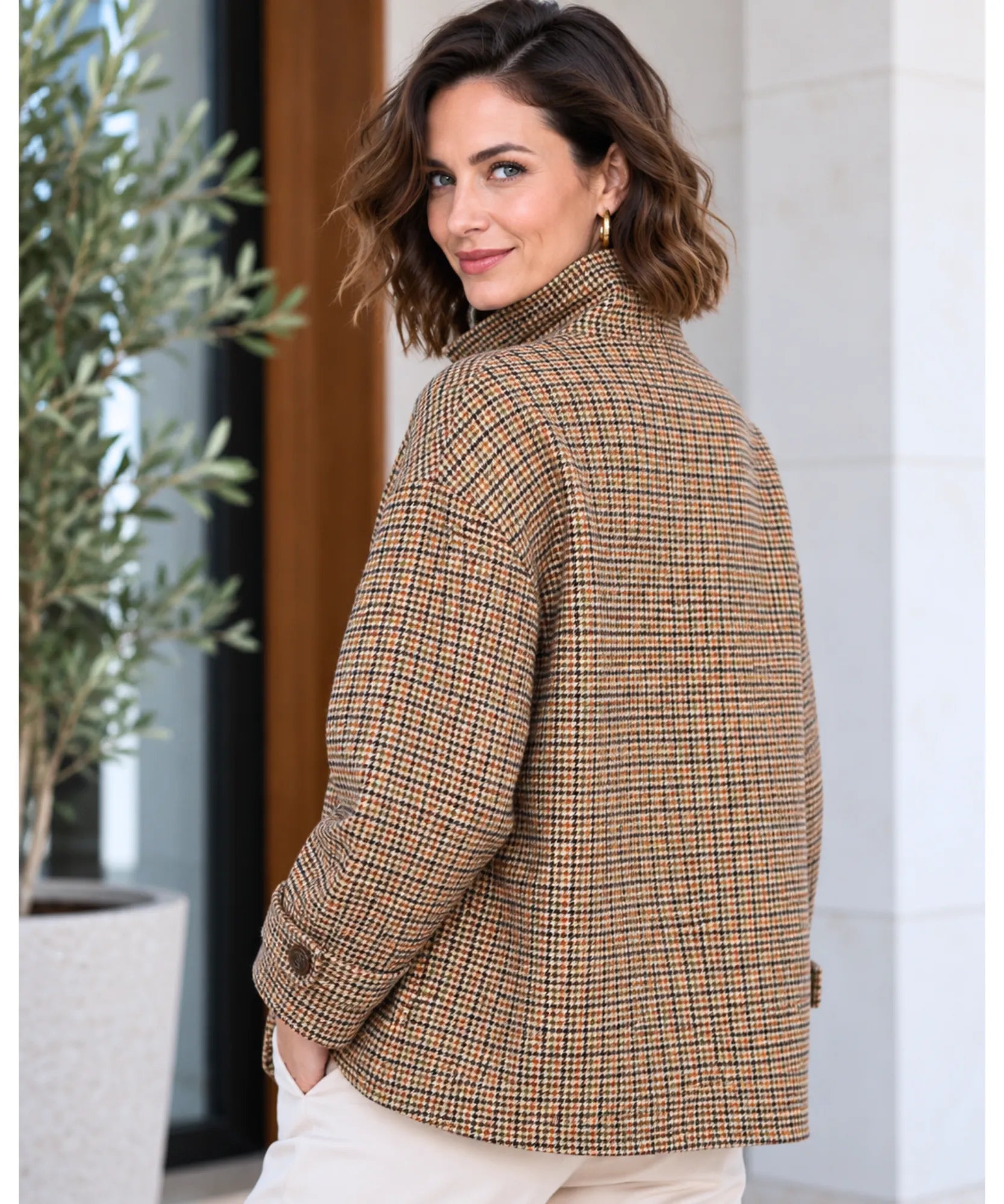 Women's houndstooth jacket in brown, back view with relaxed fit