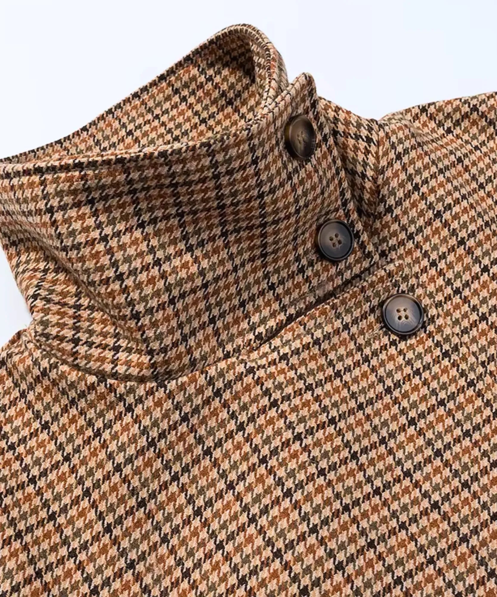 Women's houndstooth jacket, close-up of the funnel neck buttons