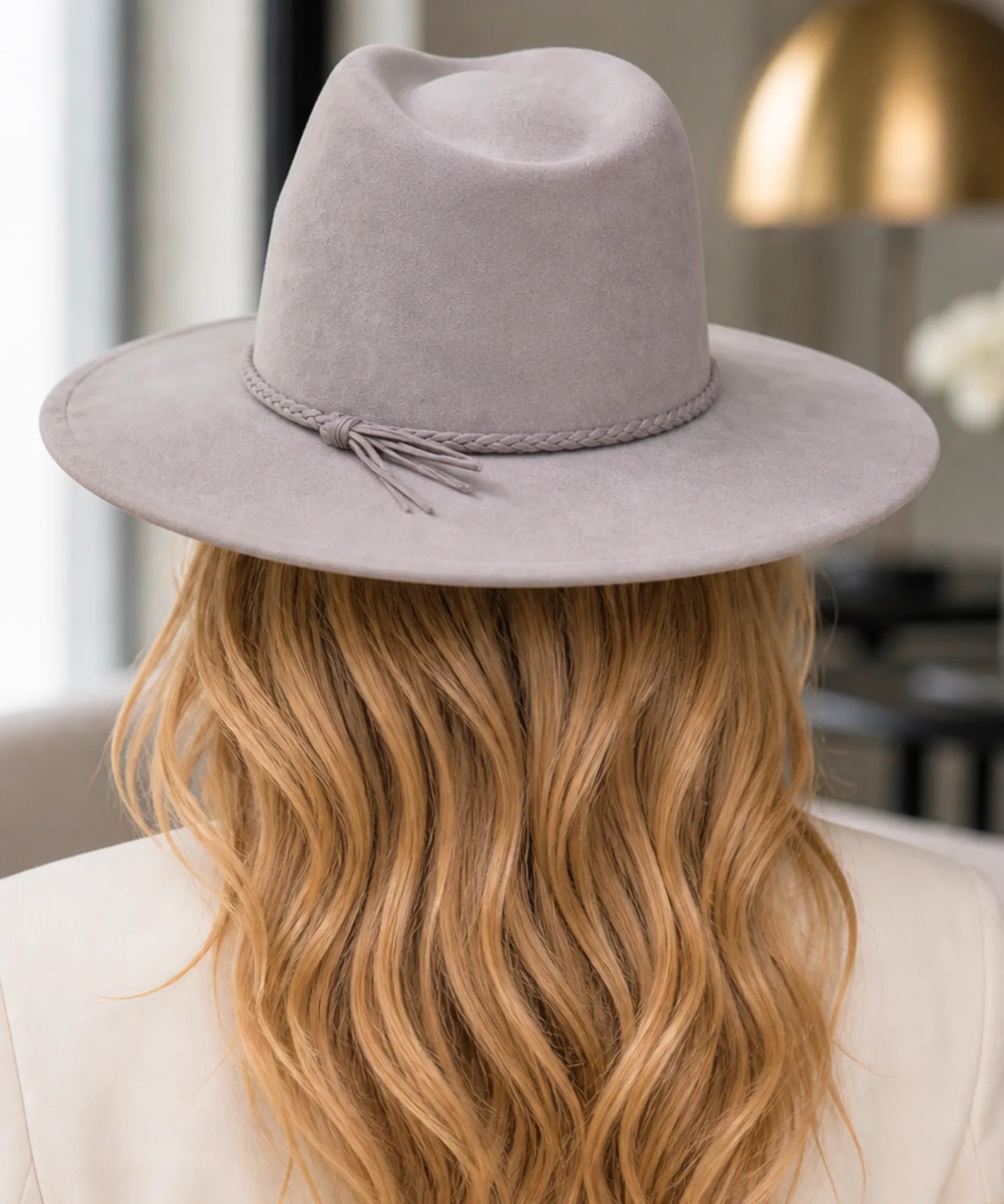 Grey wide-brim suede western hat, close-up view