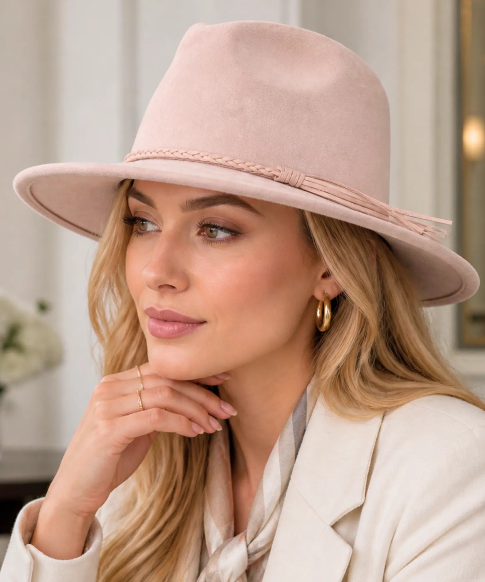 Woman wearing a Blush Pink wide-brim suede western hat