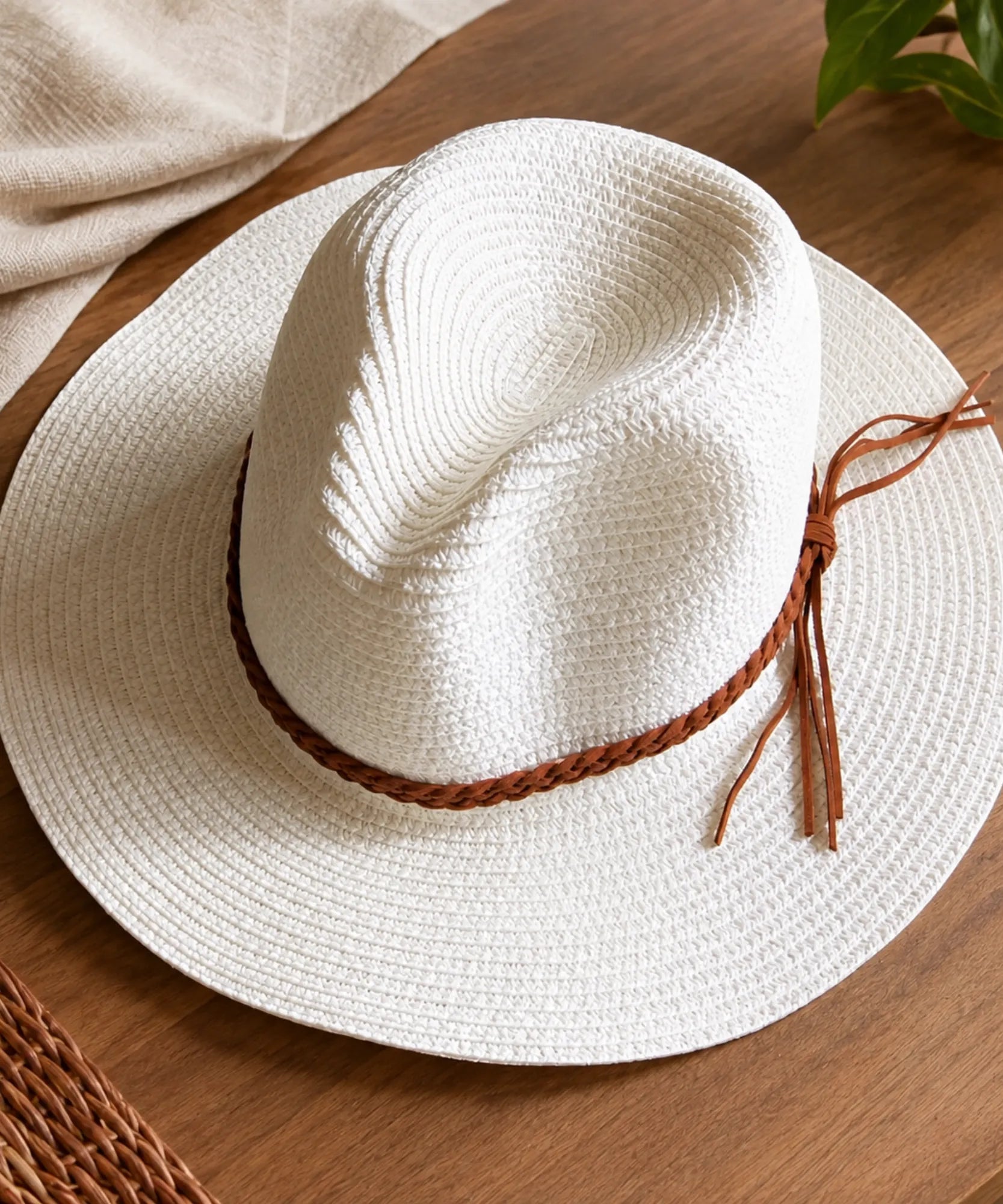Women's straw panama hat in white with a braided leather-tone cord