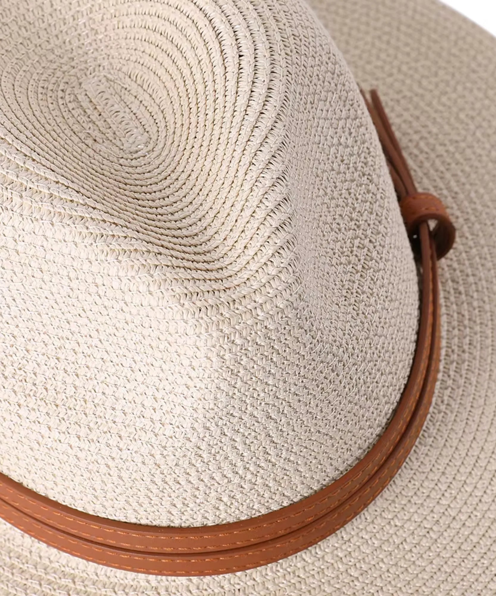 Unisex wide-brim straw fedora hat in sand, close-up of the leather band