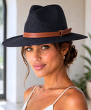Unisex wide-brim straw fedora hat in black with a leather band