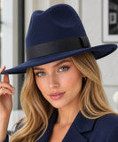 Woman wearing a Navy wool felt fedora hat