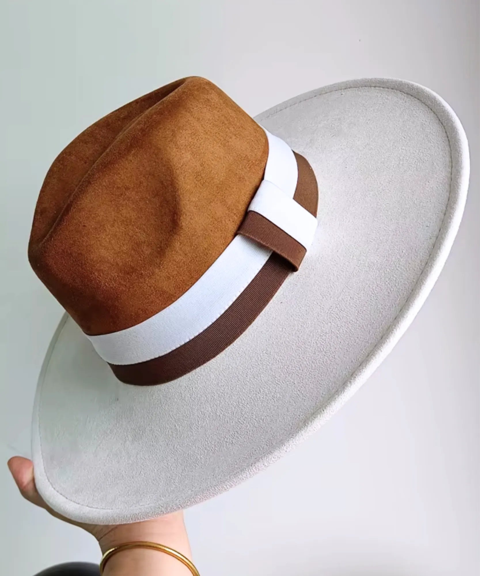 Women's wide-brim suede fedora hat with a two-tone band, front view