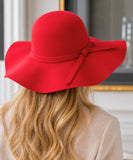 Woman wearing a Red wide-brim wool felt fedora hat