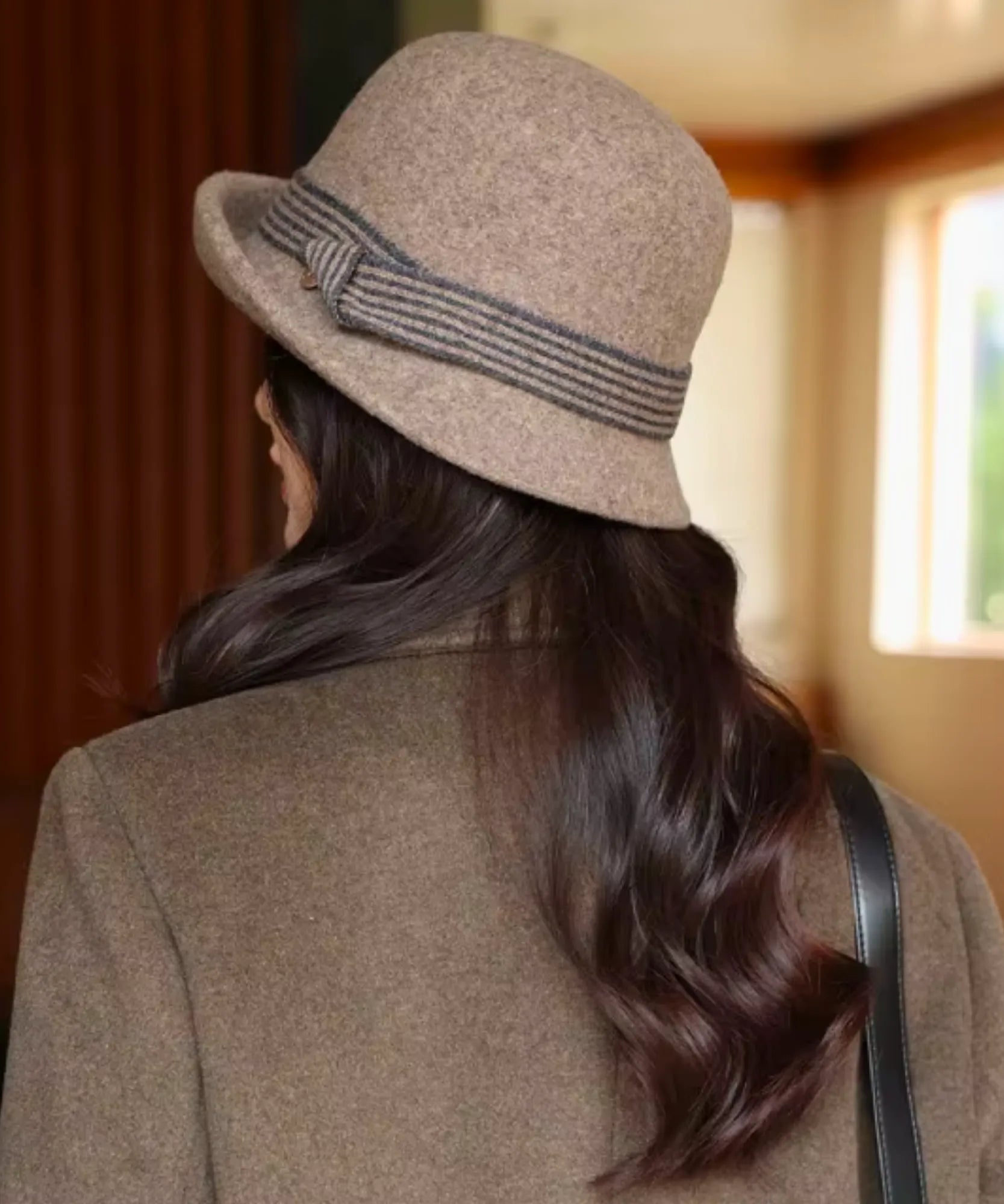 Women's Wool Felt Cloche Hat in Camel with a striped band, back view