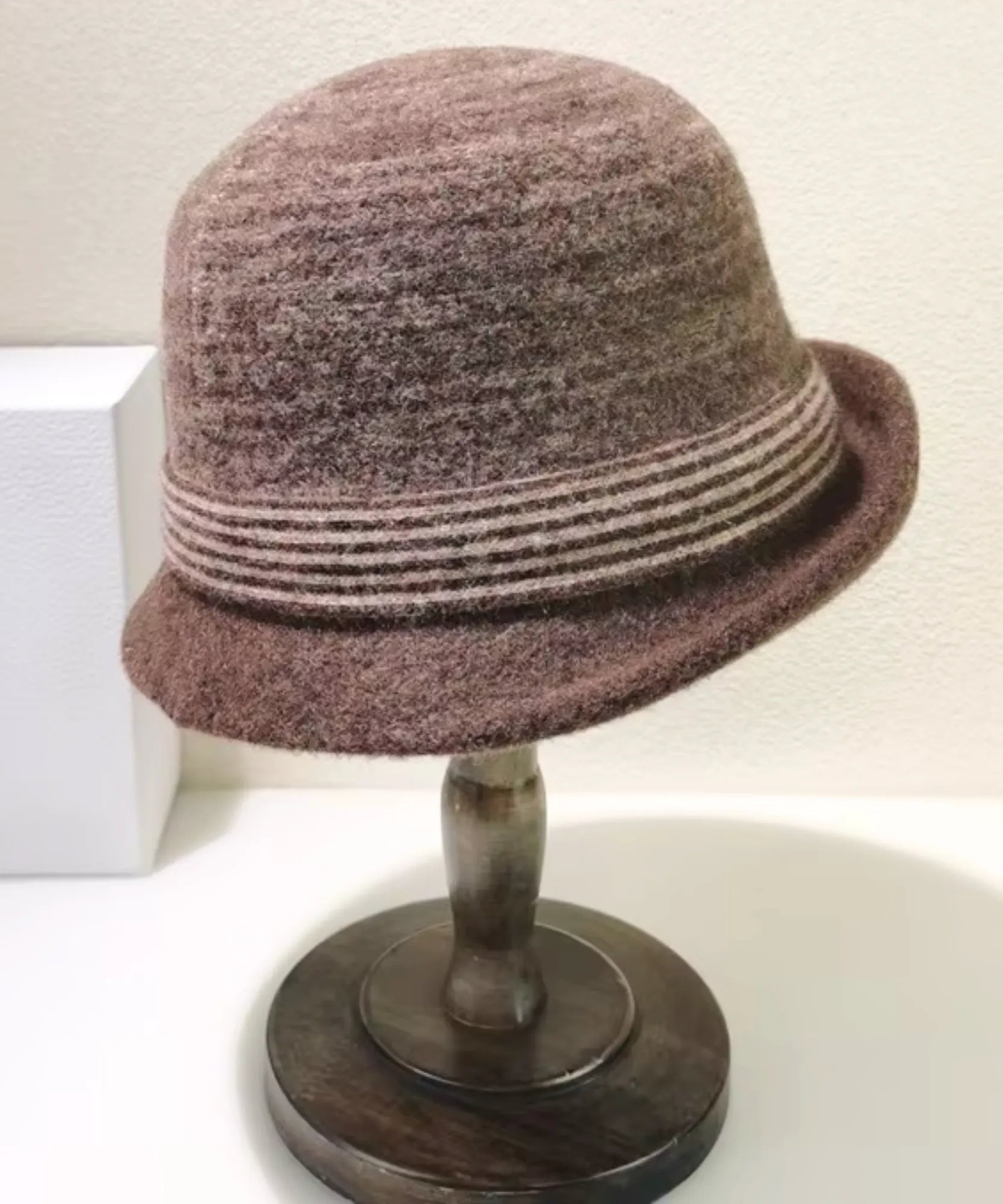 Women's Wool Felt Cloche Hat in Mocha with a striped band, displayed on a hat stand