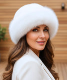 Woman wearing a White fur hat with a flannel lining