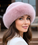 Woman wearing a Blush Pink fur hat with a flannel lining